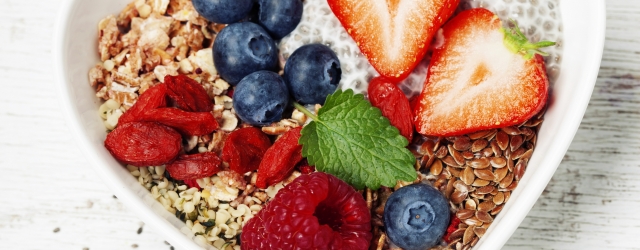 Healthy breakfast of muesli, berries with yogurt and seeds